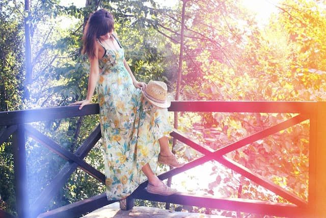 A custom made floral print maxi dress in golden light