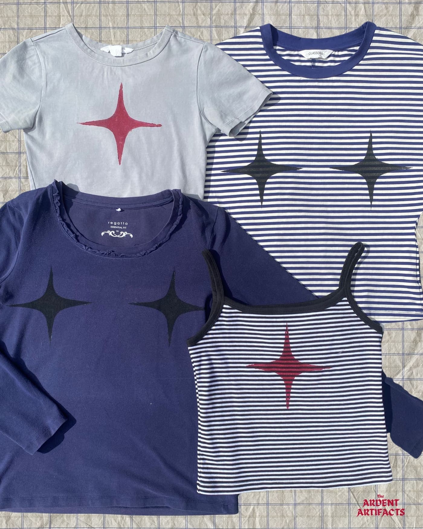 Four-point star lino prints on navy, grey and striped tops
