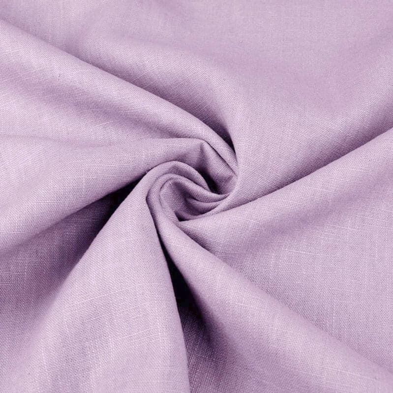 Lilac pure linen gathered into soft folds, the slubby weave catching the light