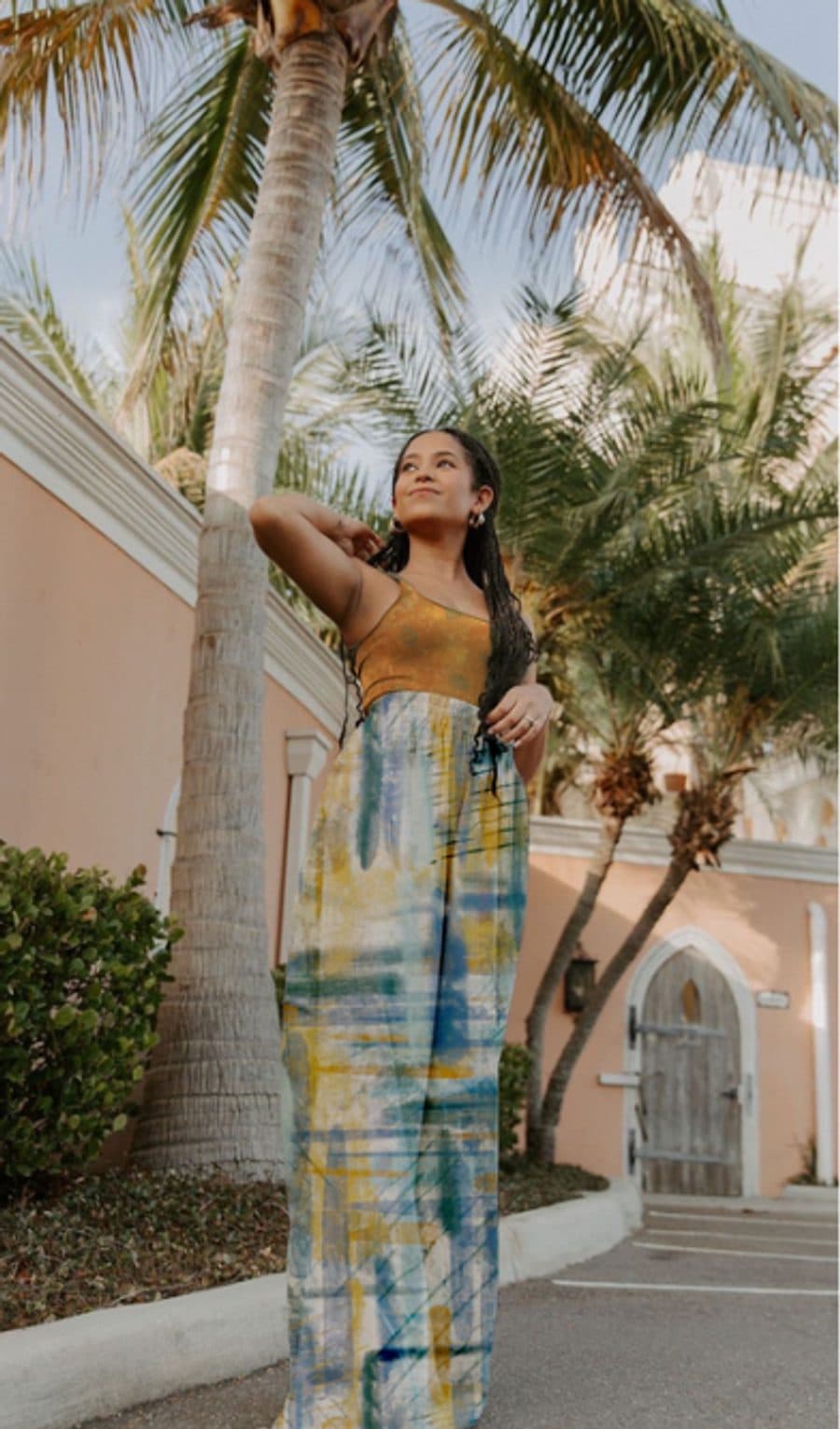 Digital mockup of wide-leg trousers in a blue and yellow brushstroke print